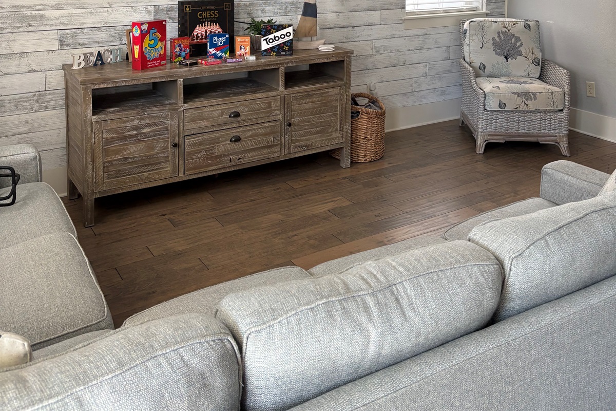 Cozy living room details with stylish furnishings and game storage.