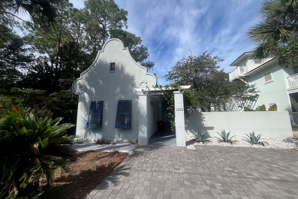 Mediterranean 1 level living steps from the beach with lush tropical courtyard and private pool.