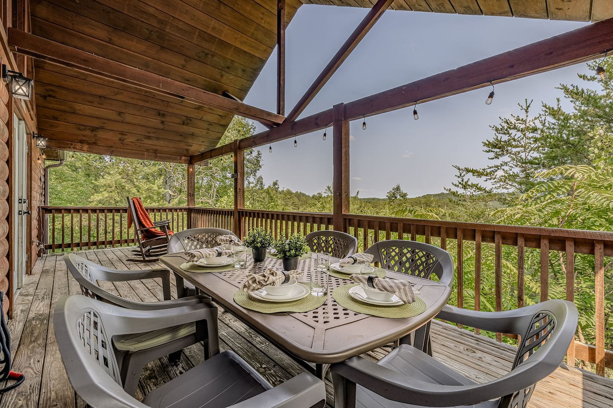 Dine outdoors on the covered deck while enjoying peaceful Smoky Mountain views.