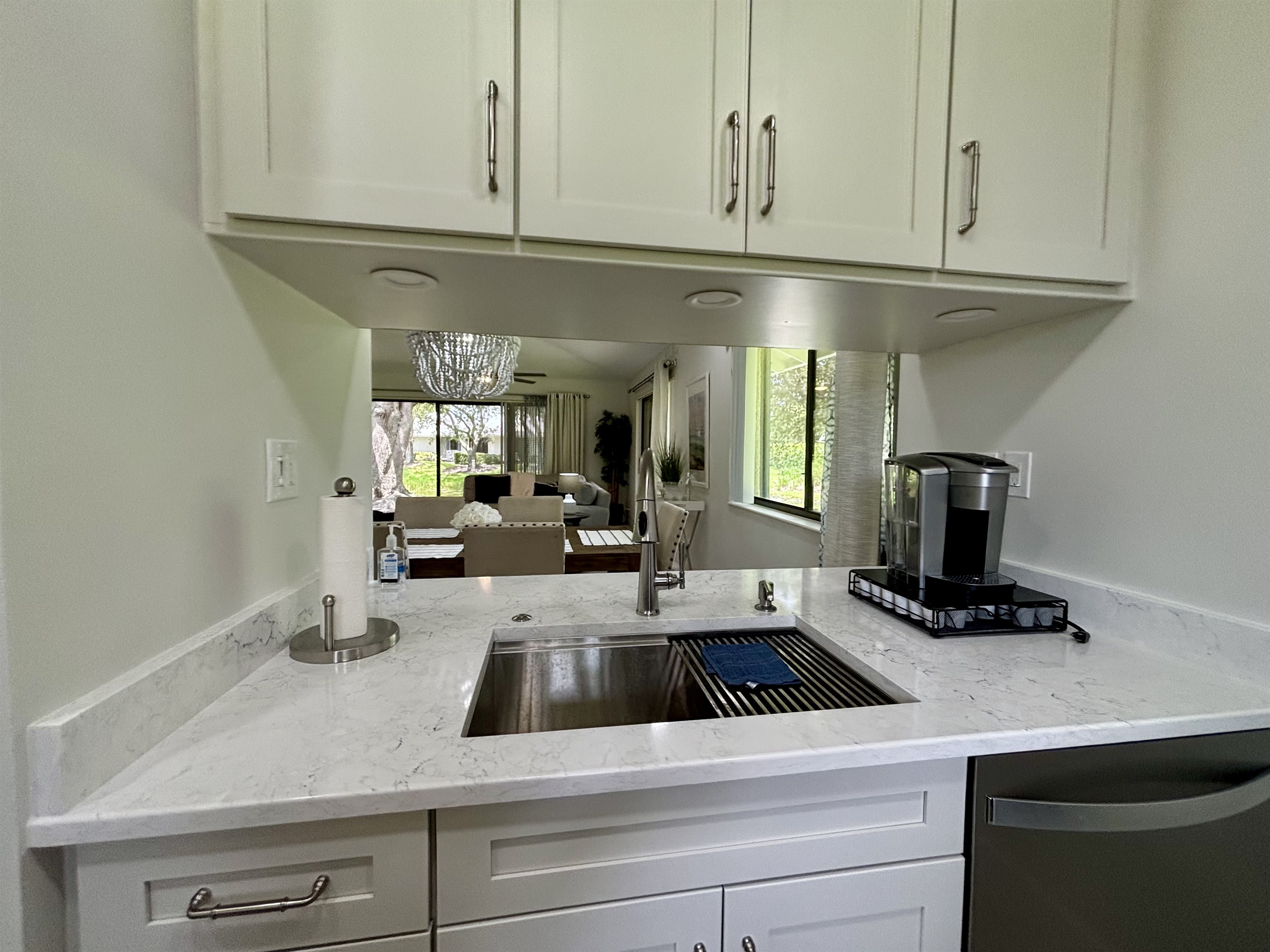 The galley-style kitchen is well-equipped with all the essentials needed to make home-cooked meals together.
