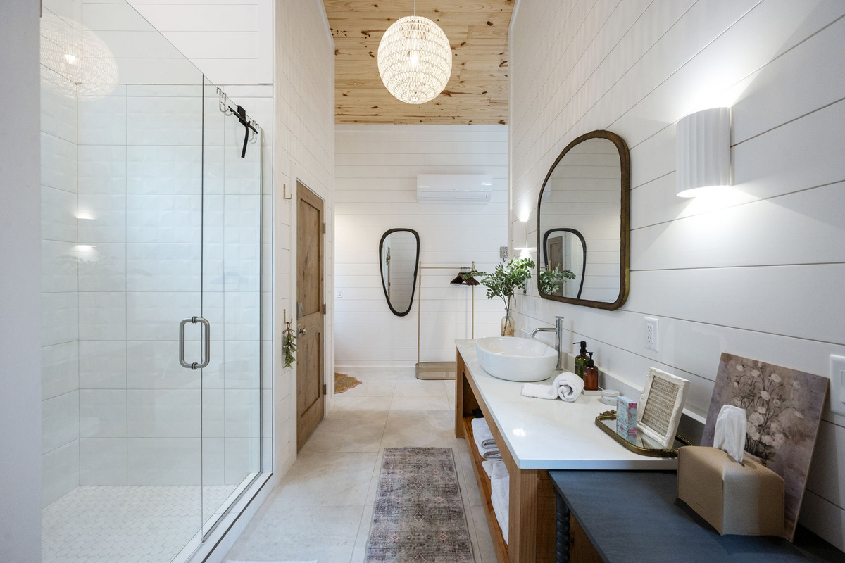 The private casita ensuite bathroom offers a luxurious, spa-like experience with premium finishes, warm design touches, and complete privacy—creating the perfect place to relax and recharge.