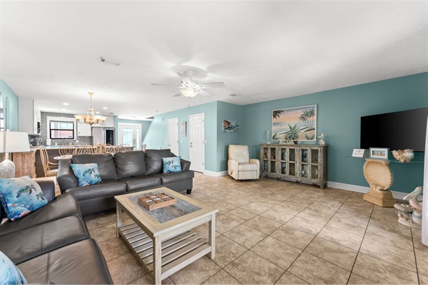 Large, spacious living area with new furniture, smart TV