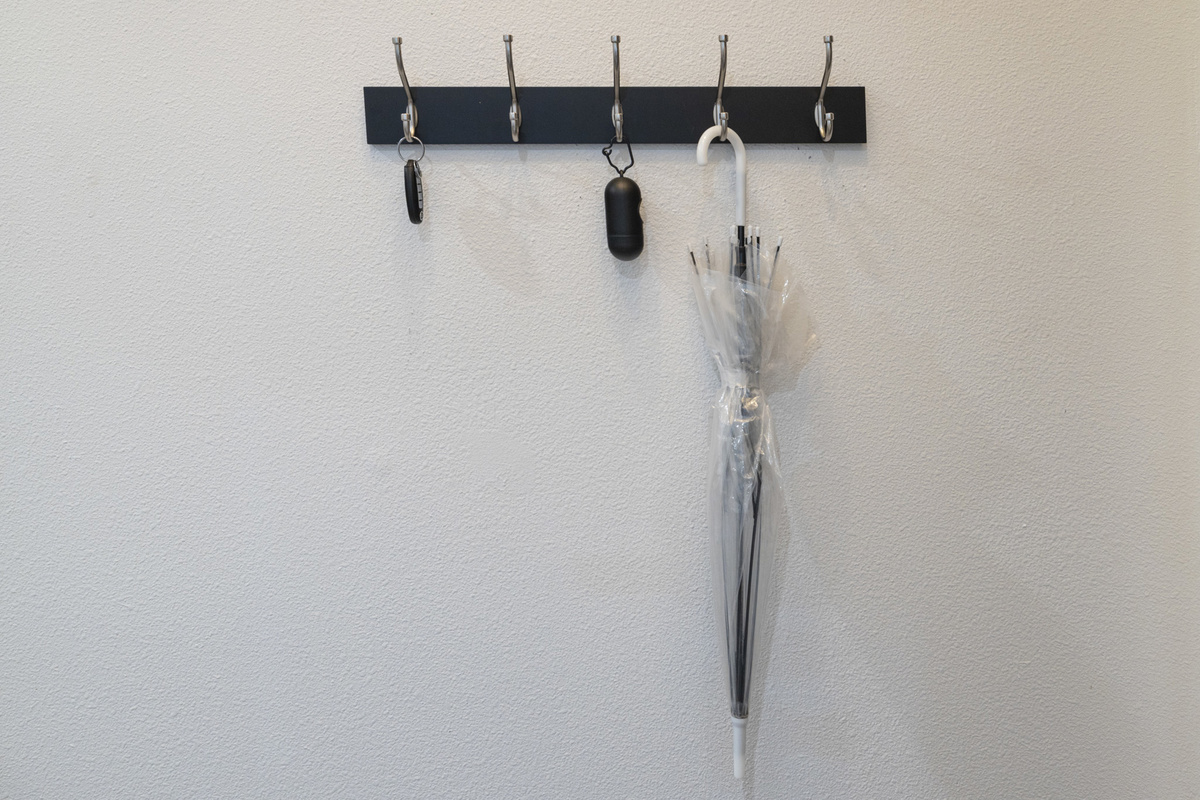 Modern hooks for your essentials, including an umbrella for unexpected Austin showers!