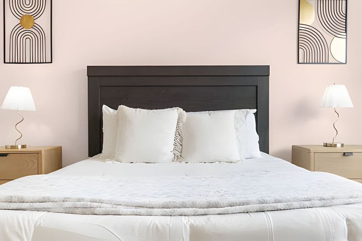 Serene bedroom with plenty of natural light.