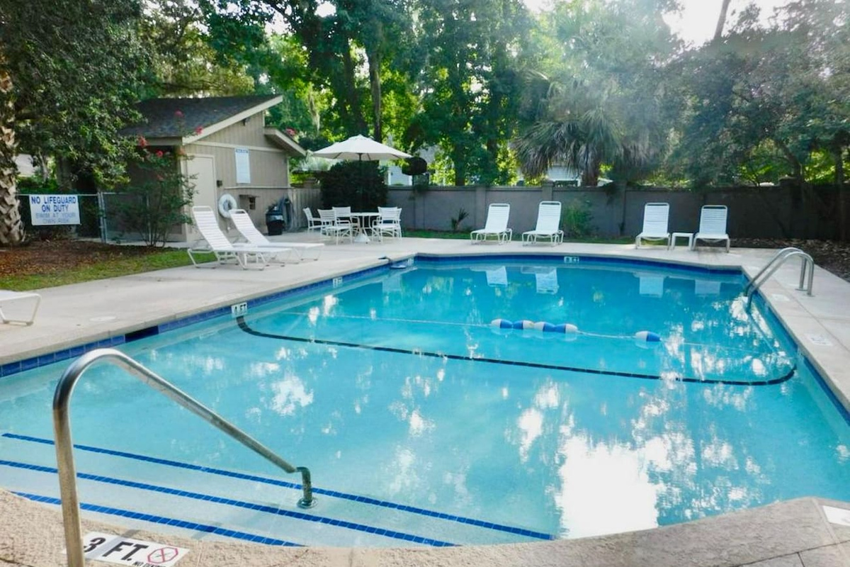 Community pool with lounge chairs