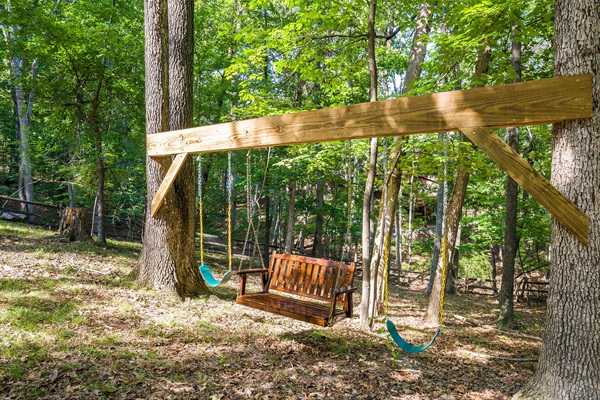 Classic swings plus a bench swing—fun for kids and a peaceful perch for adults