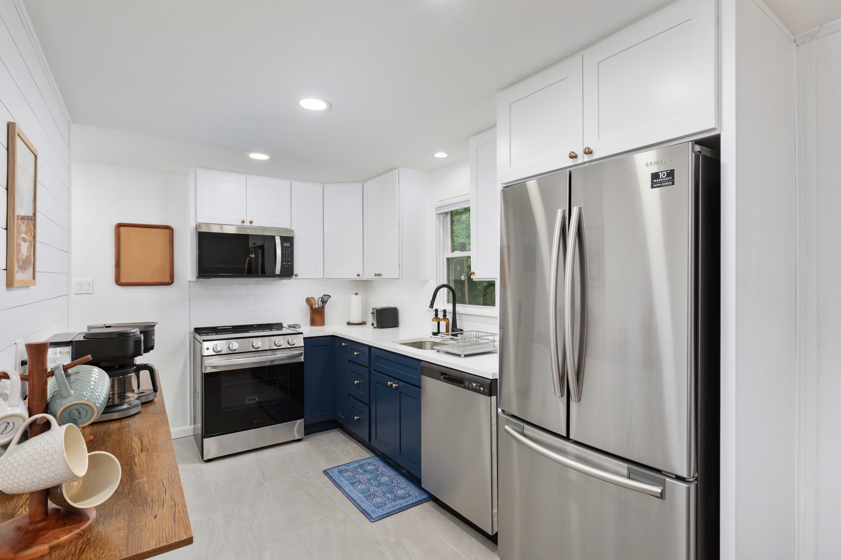 This kitchen was made for cooking up good memories — sleek stainless appliances, ample space to create, and everything stocked and ready, from pots and pans to the toaster and blender.