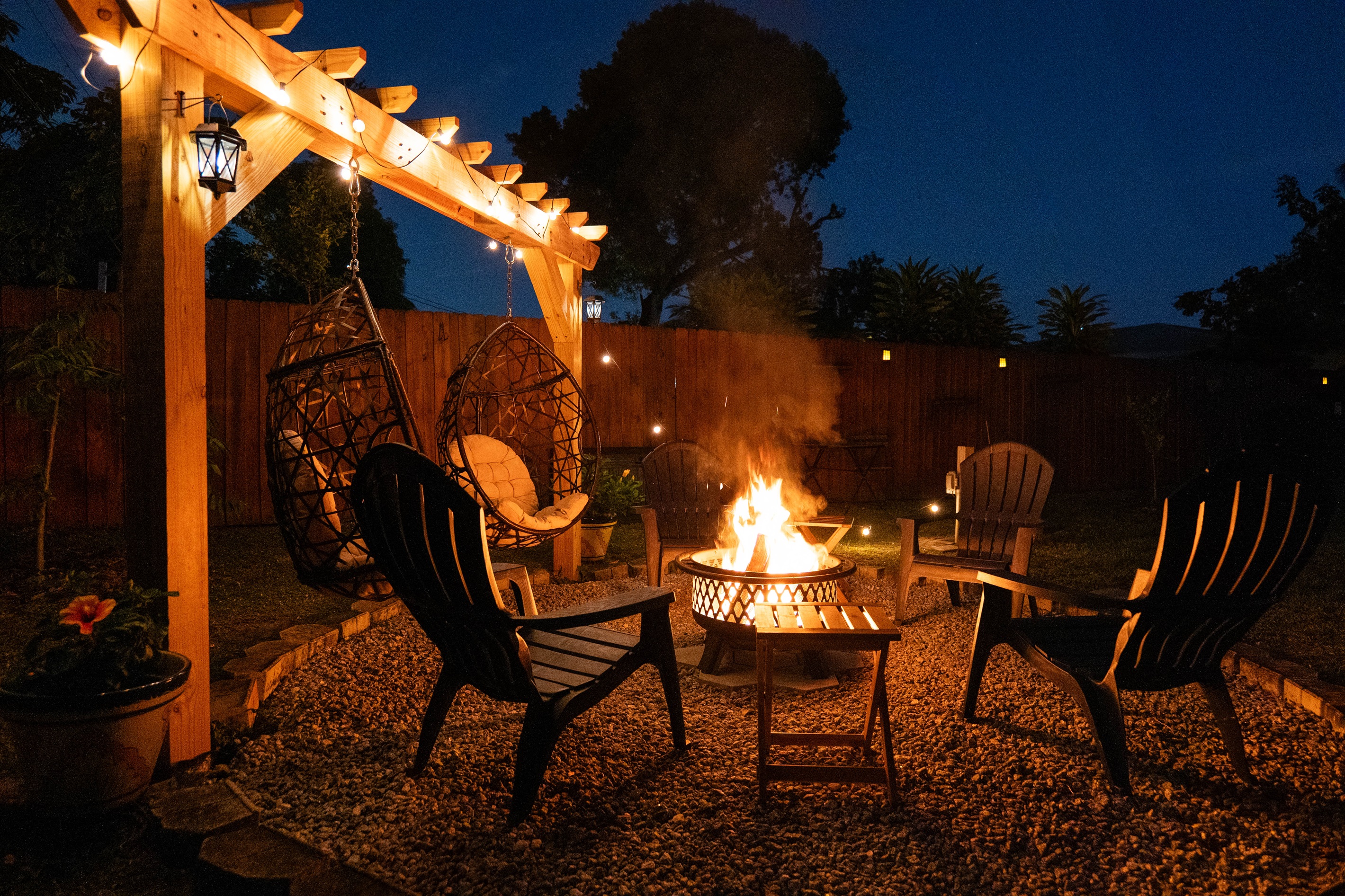 Fire Pit Lounge /w String Lights & Hanging Egg Chairs