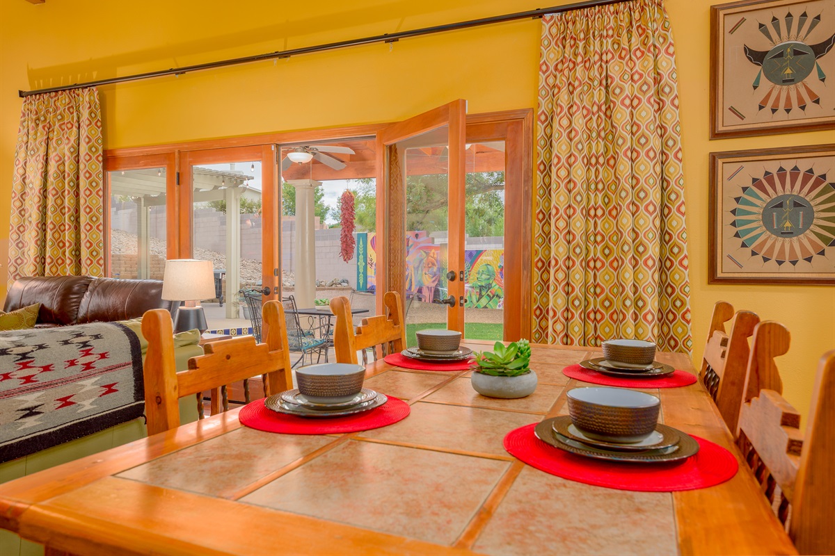 Large doors expand the indoor living space into the outdoor patio setting