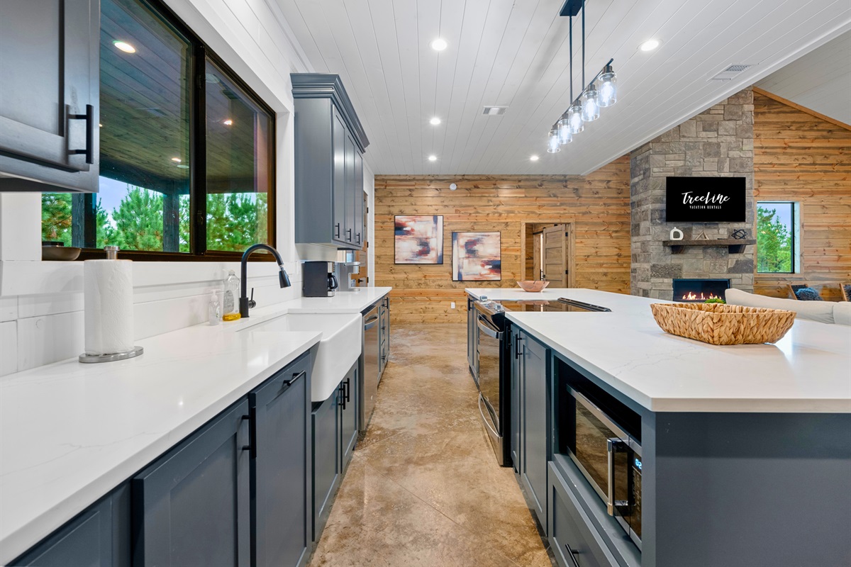 Bright, modern kitchen fully stocked for meals and entertaining.