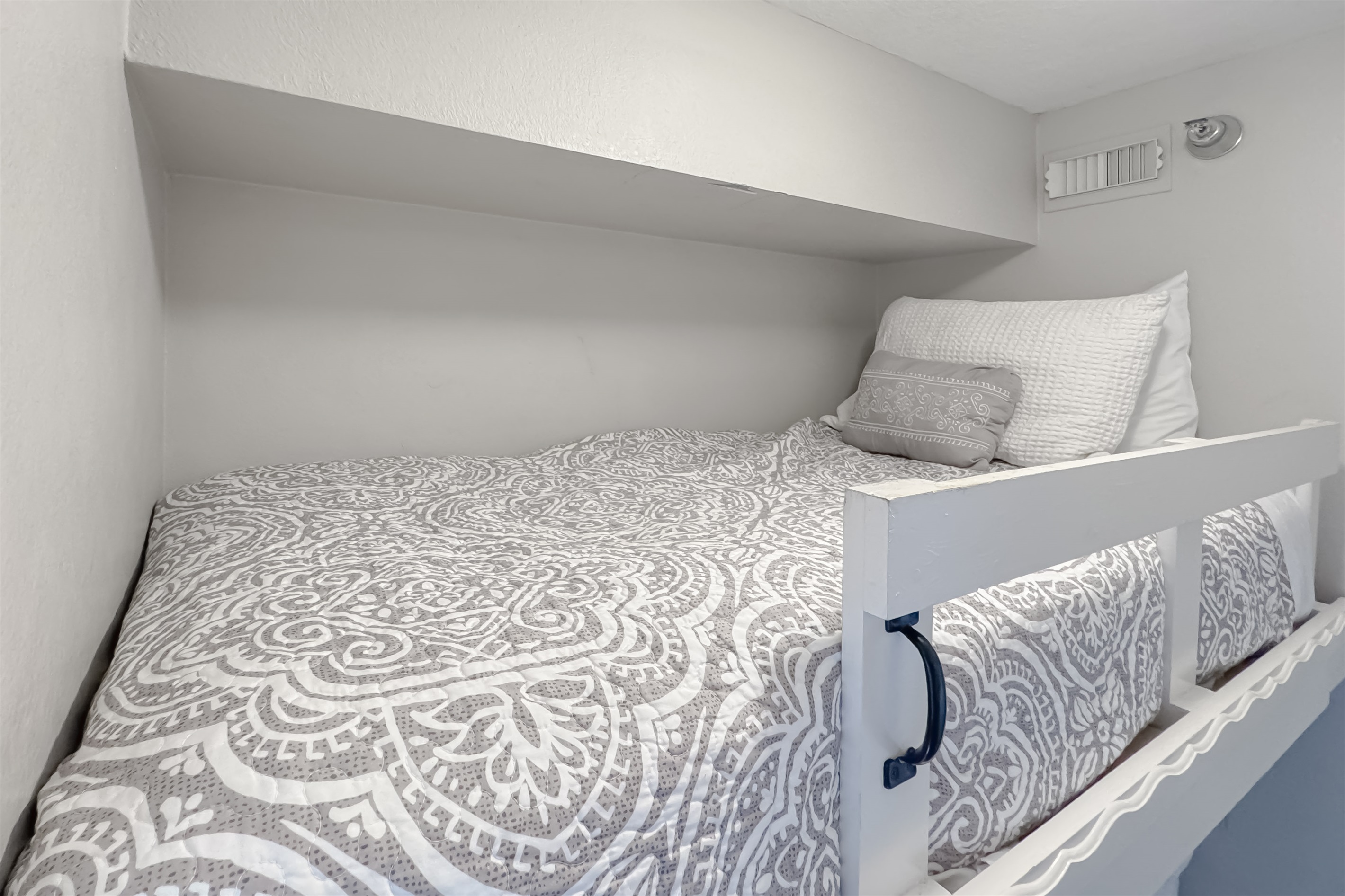 Versatile bunk bed room offering comfortable accommodations for guests or family. This space maximizes functionality and style, providing a cozy and inviting atmosphere.