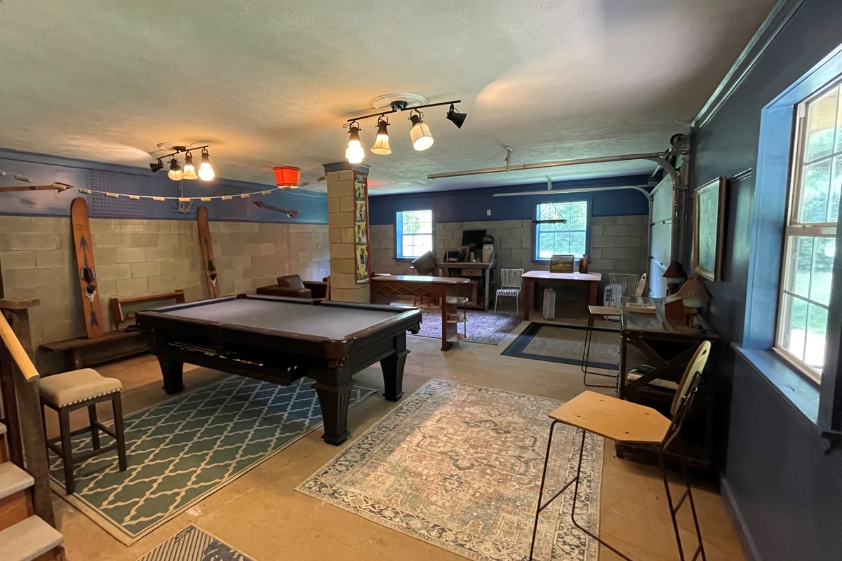 Down the stairs is where the action is with pool table