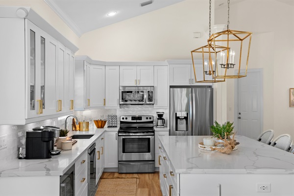 Fully Stocked Kitchen w/ Bar Seating and Two Tables!
