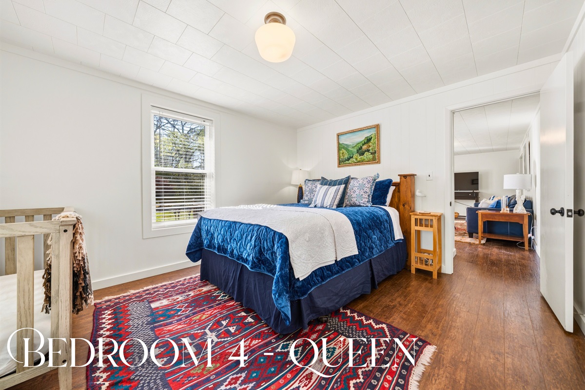 Step into this queen bedroom where soft textures, warm tones, and a comfortable bed create a restful retreat after a long day.