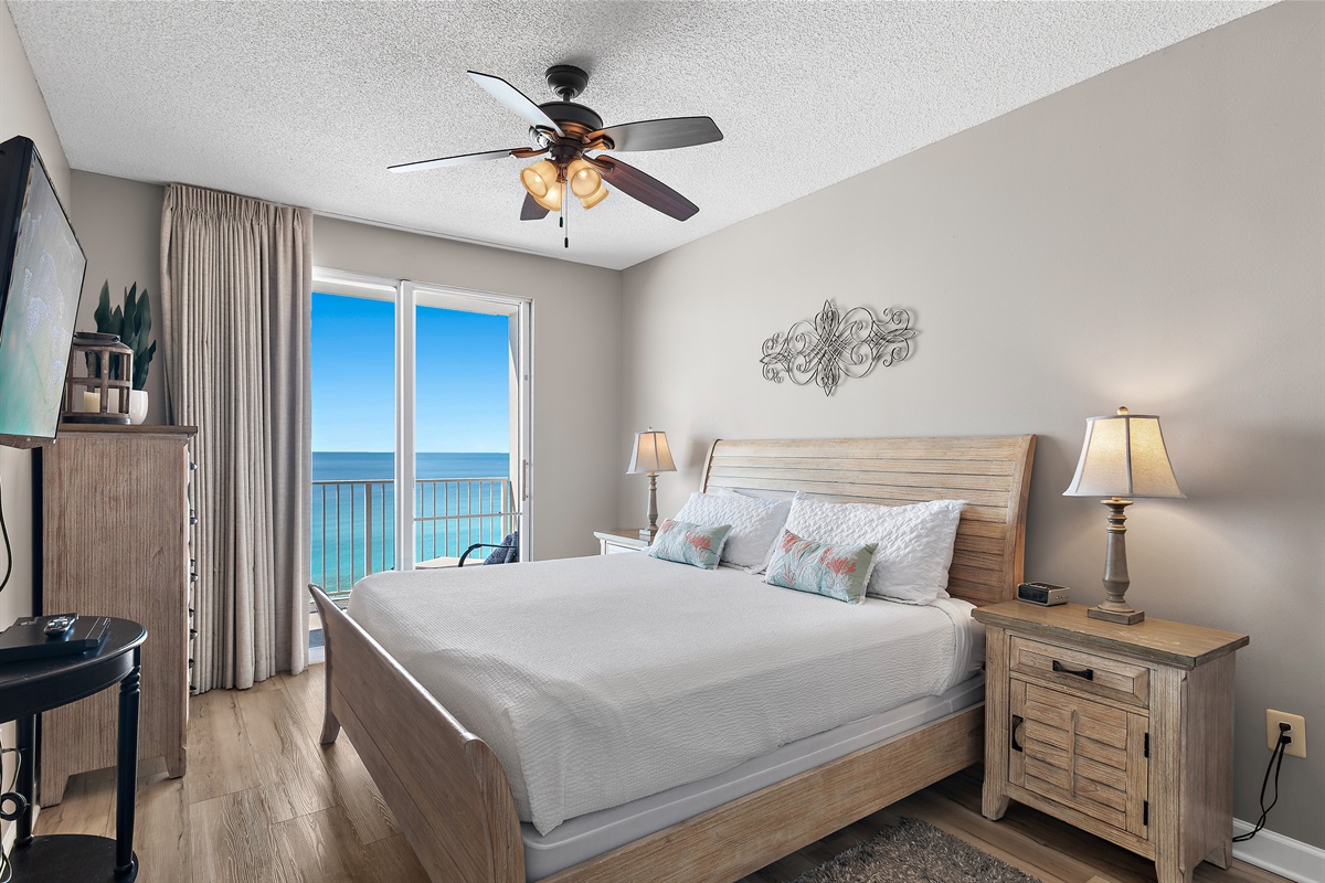 Spacious master bedroom features a King bed, Gulf views, balcony access, SMART TV w/ cable access, bathroom with dual vanity and shower/tub combo, and large closet.