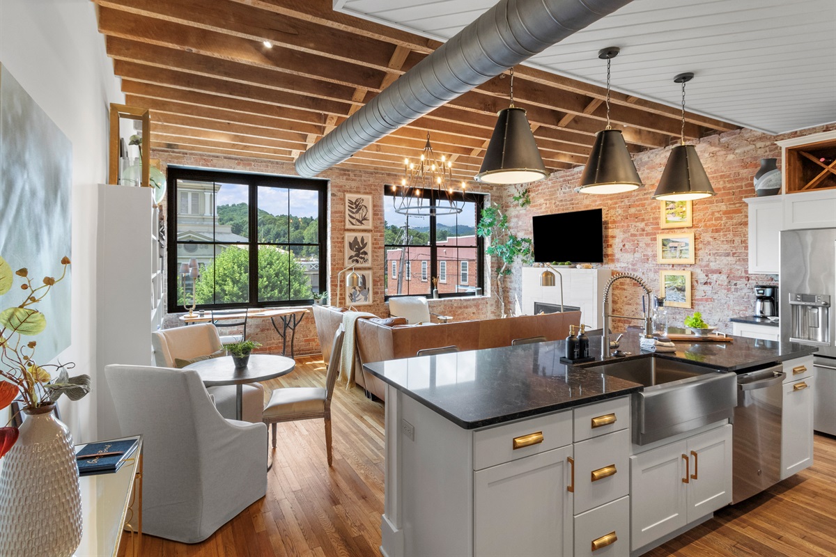 View of the open kitchen and living room from the hallway