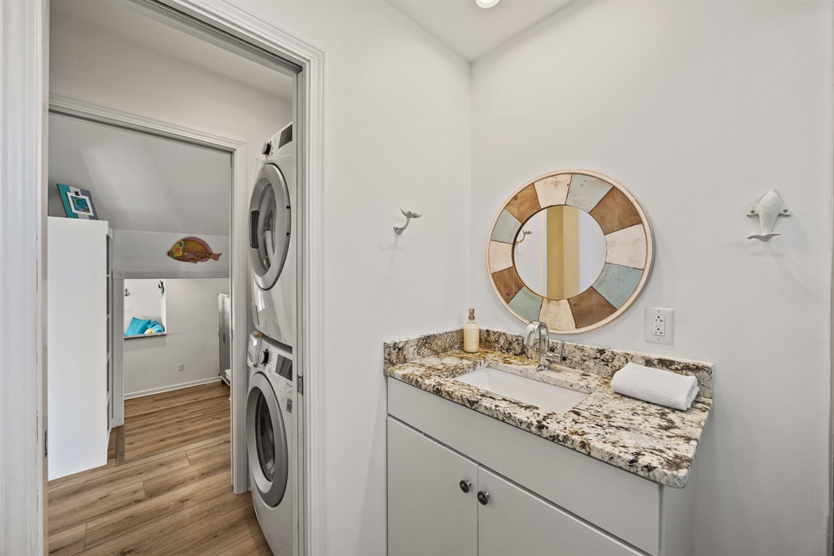 Upstairs bath with double vanity and in-unit washer and dryer