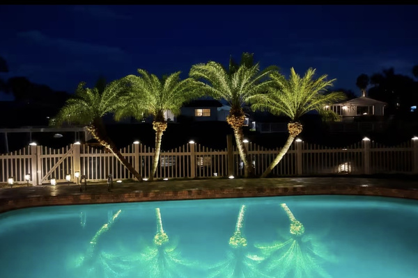 Pool illuminated at night creating the perfect evening retreat