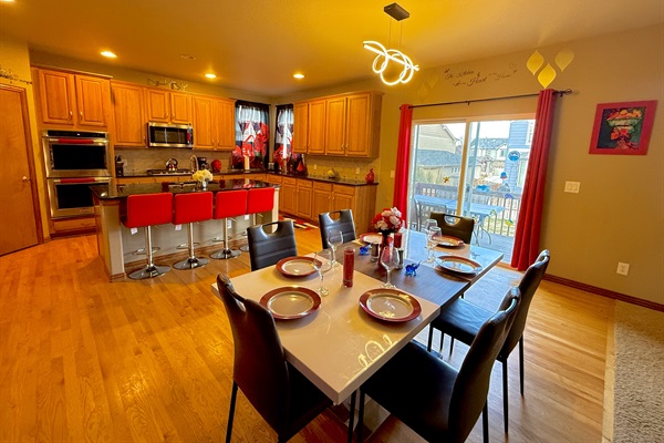 Vast kitchen and dining space overlooking a charming patio, offering a delightful atmosphere for dining and unwinding