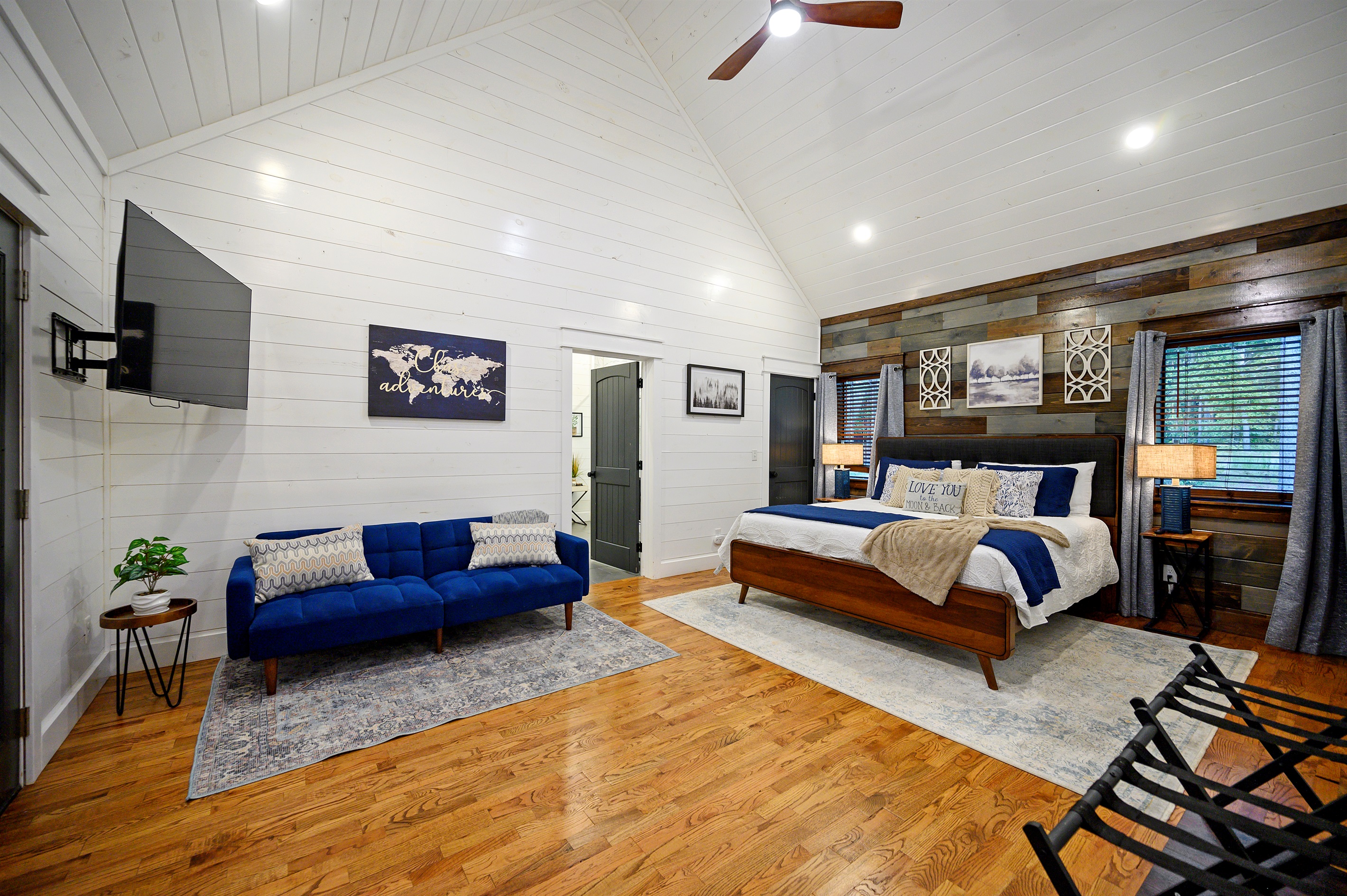 Wide angle shot of your Master Bedroom.  The door between your couch & bed leads to your Master Bathroom.  Watch your favorite shows on your Smart TV whenever the mood strikes.