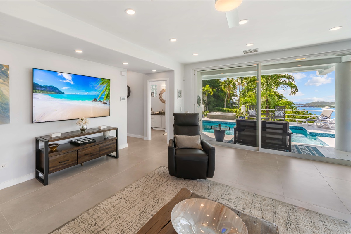 Bonus living room with Smart TV and sliding doors to the pool deck