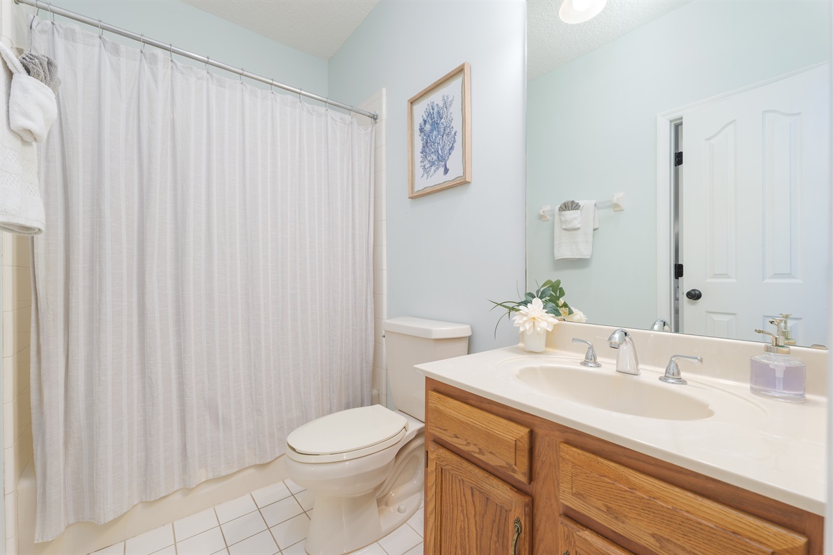 Clean, bright, and simple - a shared bath that has everything you need