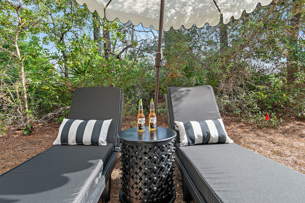 Unwind on the comfortable chaise loungers beneath the umbrella—your own peaceful spot for afternoon reading, relaxing with a cool drink, soaking up the coastal breeze, or simply enjoying a little quiet time and privacy.
