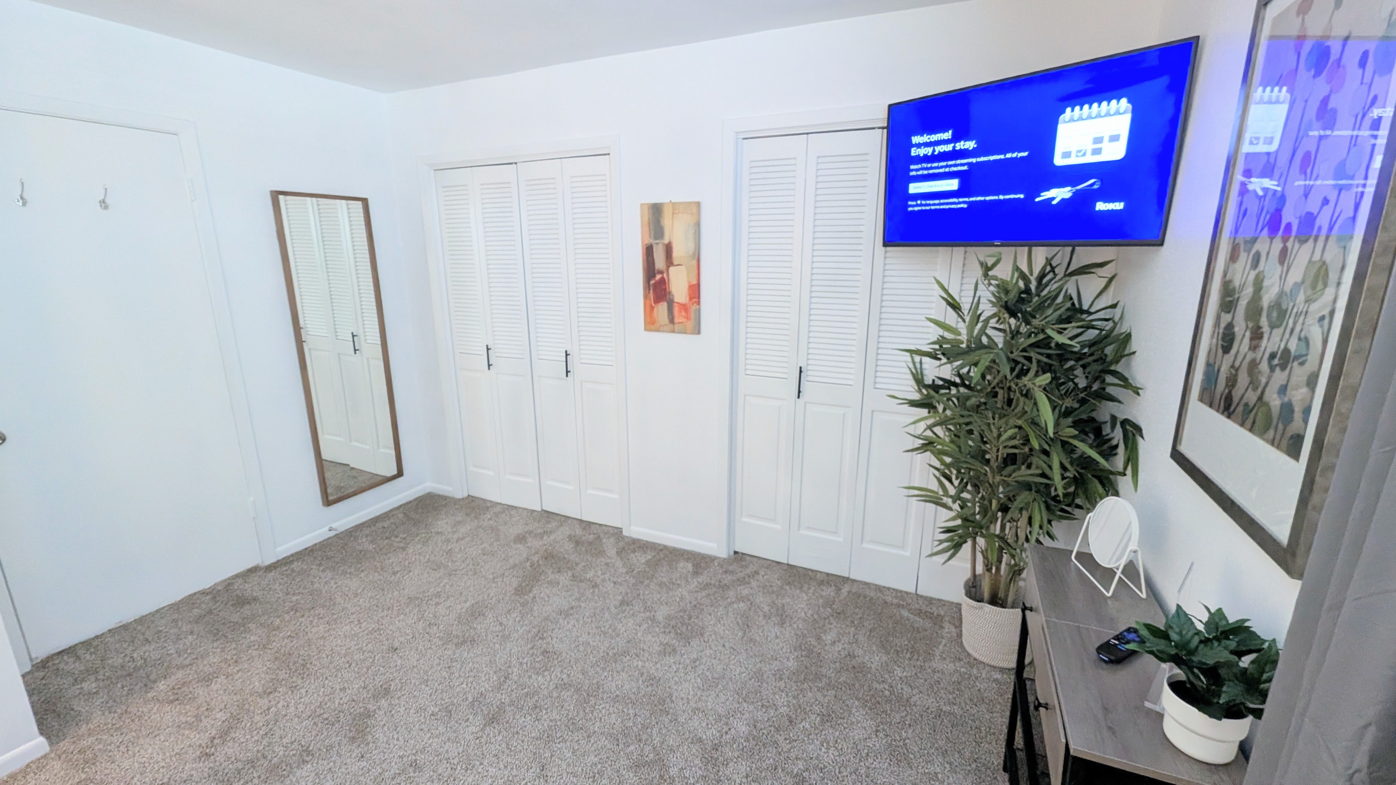 Relax while enjoying the Roku TV, checking your look in the full-length mirror, or using the two walk-in closets for ample storage.