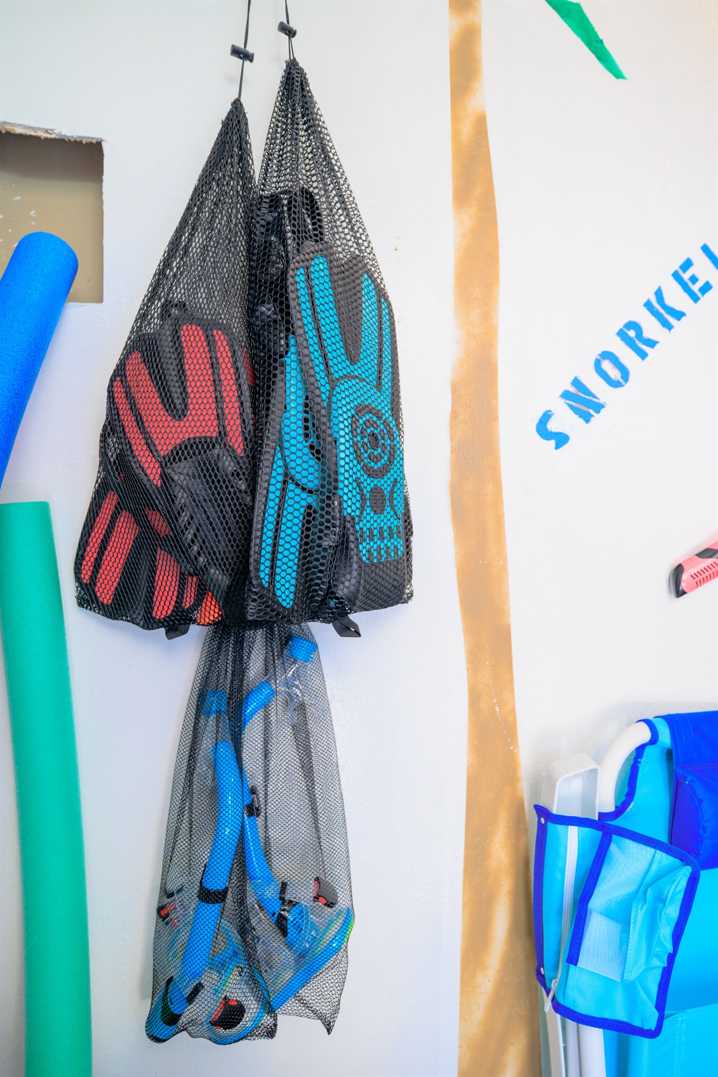 Beach room full of Towels, 10 oversized Beachchairs, Snorkeling gear, Beach Toys, wagon, backyard games, umbrella, mat, and a Cooler!