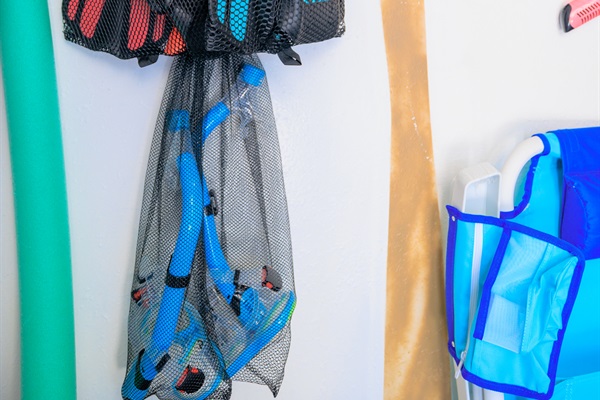 Beach room full of Towels, 10 oversized Beachchairs, Snorkeling gear, Beach Toys, wagon, backyard games, umbrella, mat, and a Cooler!