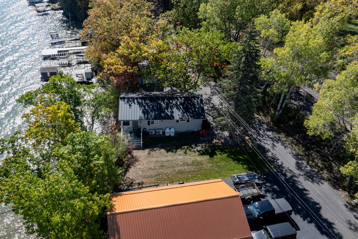 Scenic bird’s-eye view showcasing spacious grounds and peaceful wooded setting