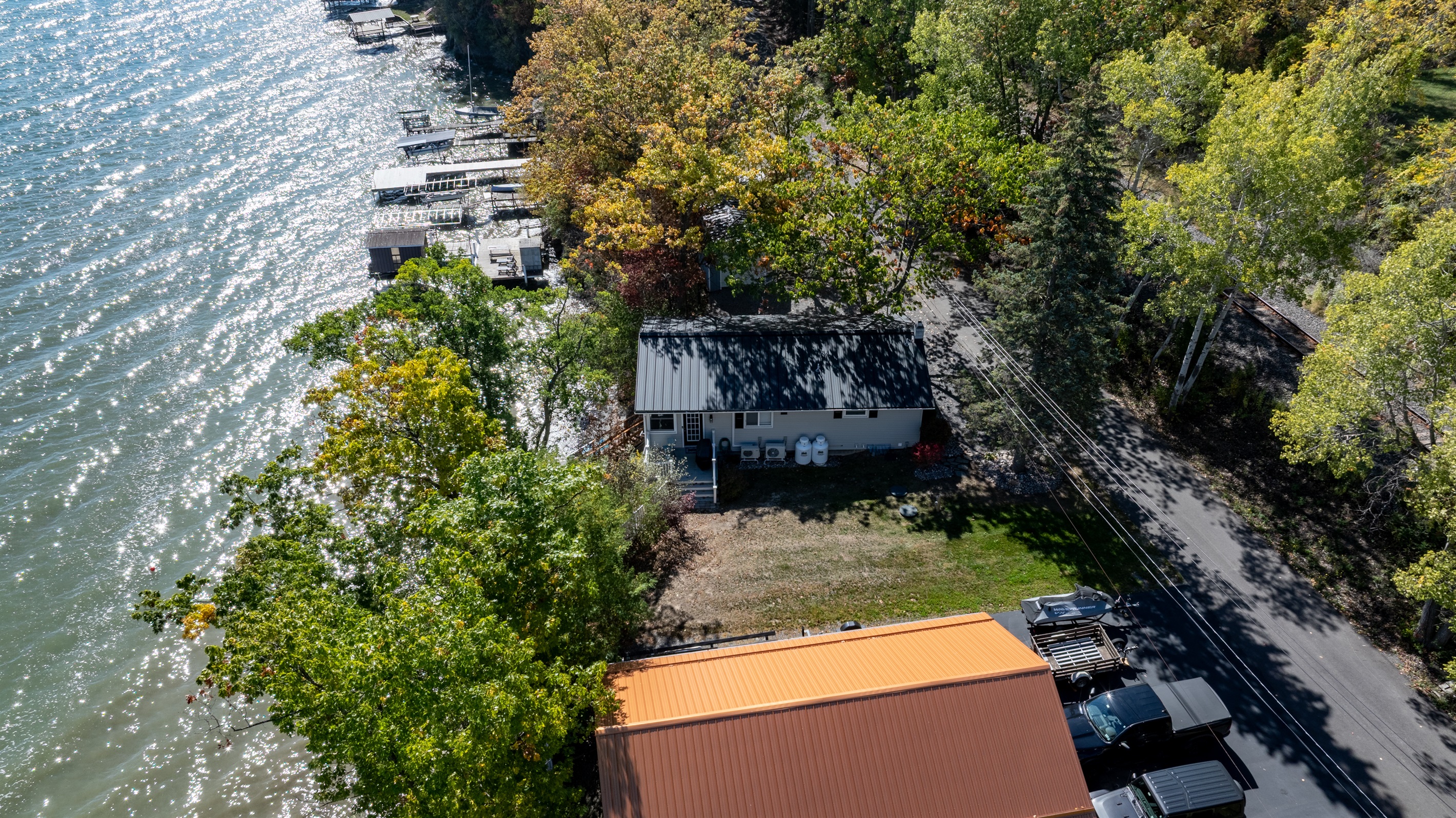 Scenic bird’s-eye view showcasing spacious grounds and peaceful wooded setting