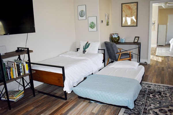 Twin daybed with twin size trundle. There is a lot of space, feel free to move the trundle wherever you'd like.