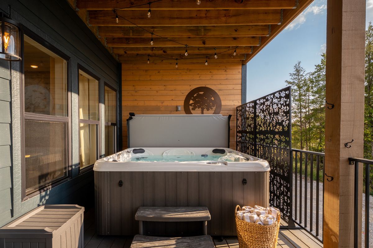 Slip into the private hot tub beneath the covered deck and relax in your own tucked-away outdoor retreat.