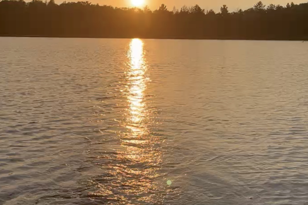 In the fishing boat with trolling motor on Little Sand Lake at sunset.  