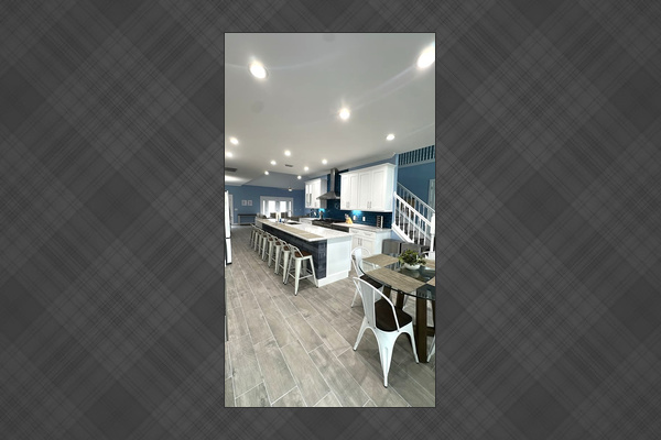 Chef Kitchen with huge island, range, two fridges, drinks fridge, and more. 