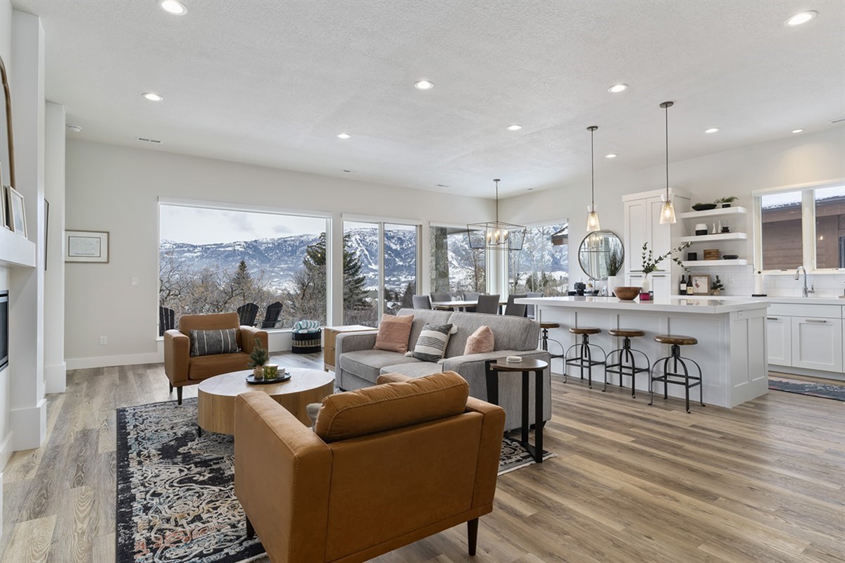 A bright, open-concept living space with modern finishes and mountain views—designed for comfort and connection.