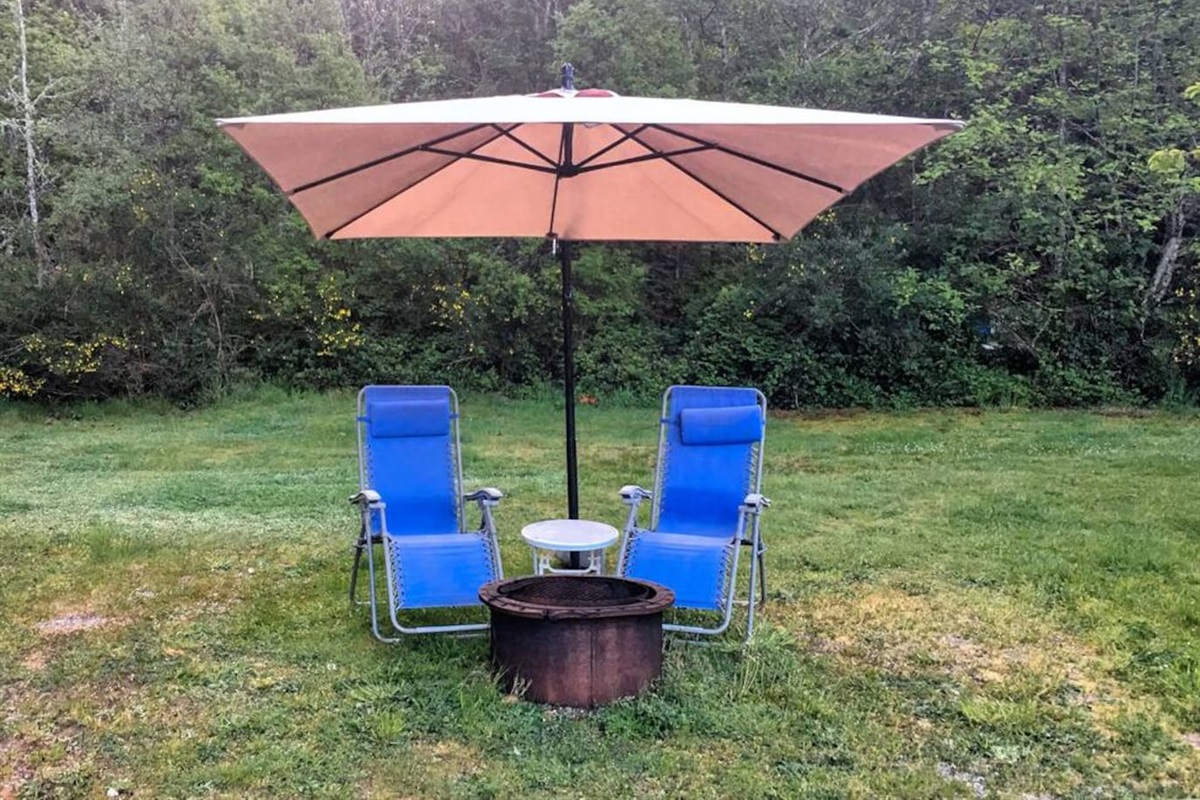 The outside Wood Fire Pit lounging area