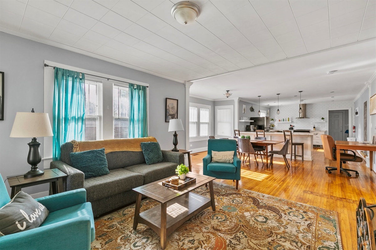 The main living area connects seamlessly to the front entry and the dining and kitchen areas, making coming and going feel easy and natural.