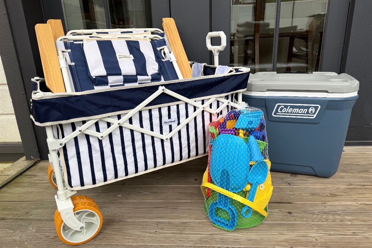 Six beach chairs, a wagon, umbrella, cooler, and beach toys included with your stay!