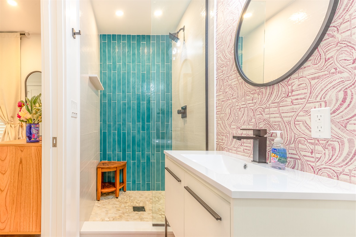 Spa-Like Retreat: Dive into vibrant tile accents and modern elegance in your private oasis!