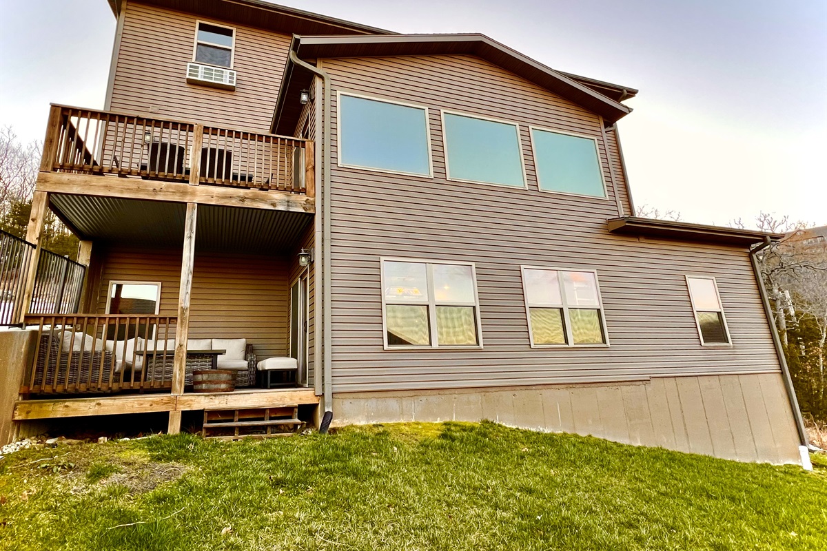 Two outdoor decks on the back with seating