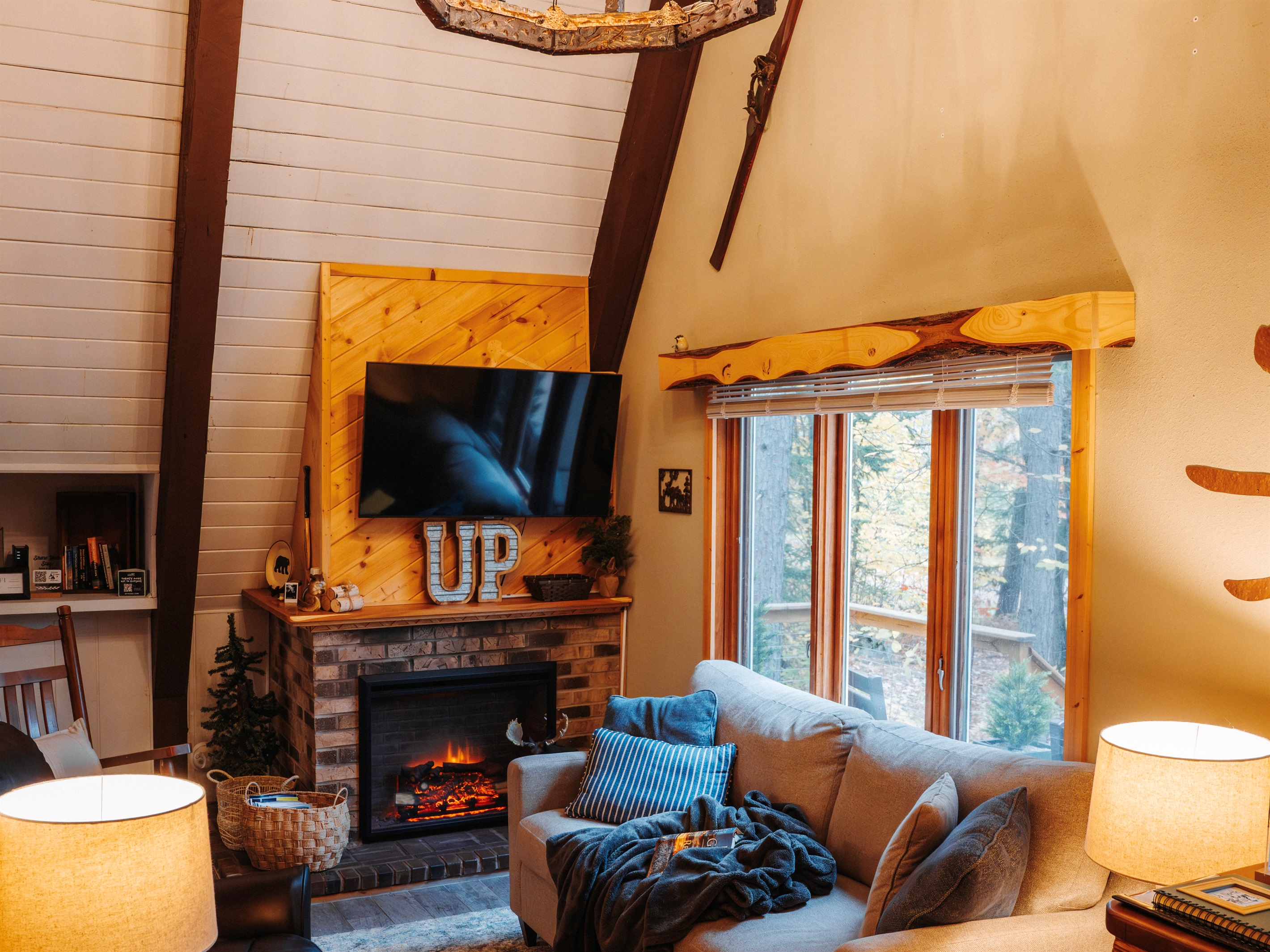 The top of the A-Frame is almost 30 feet.  Sit on the couch and get lost in the volume of the space and those incredible ceiling heights.  