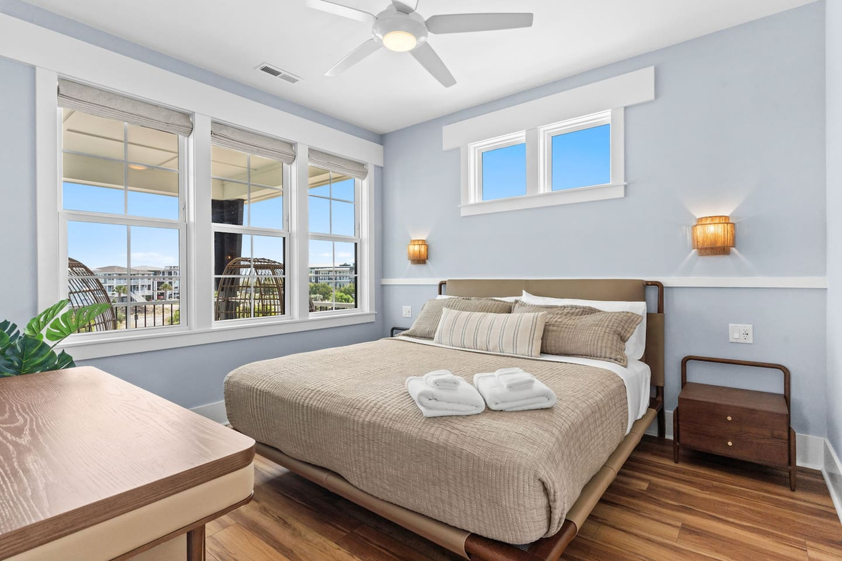 A room with a view. This inviting bedroom showcases tranquil sound views, blending comfort and coastal beauty for a relaxing retreat within Zen.