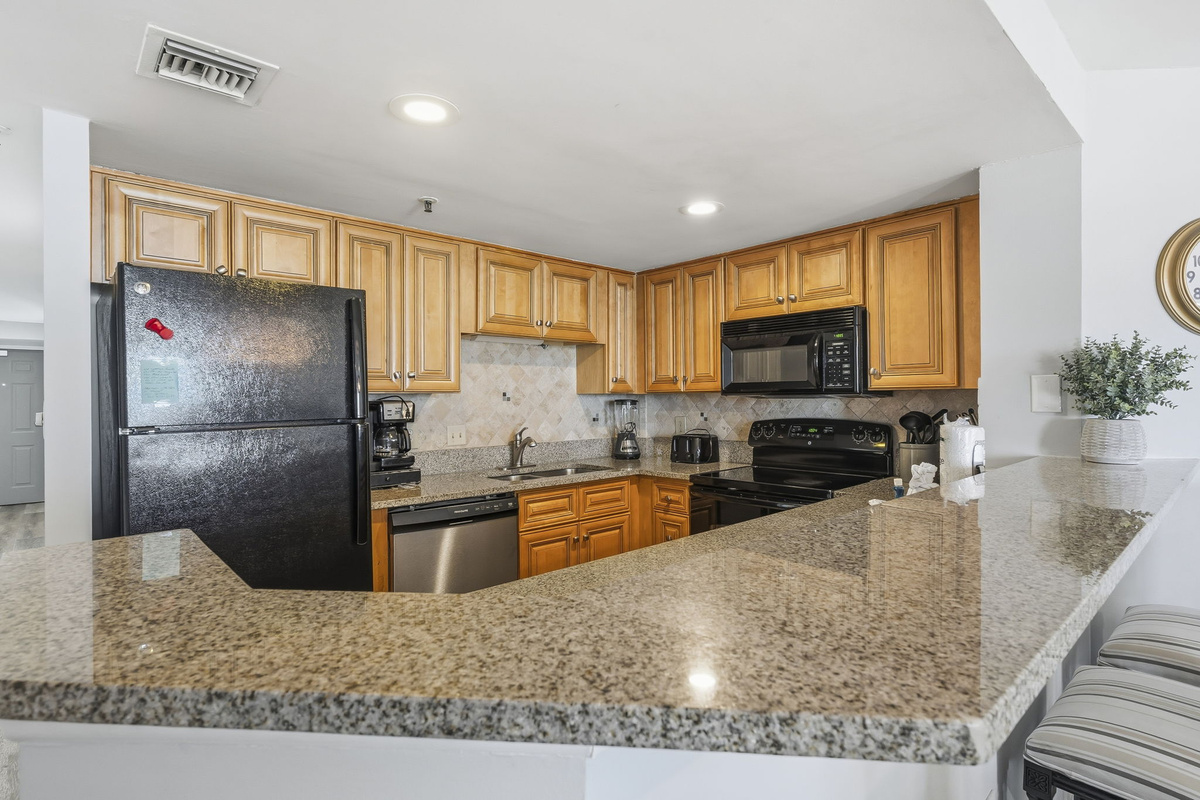 Kitchen with dishwasher and breakfast bar
