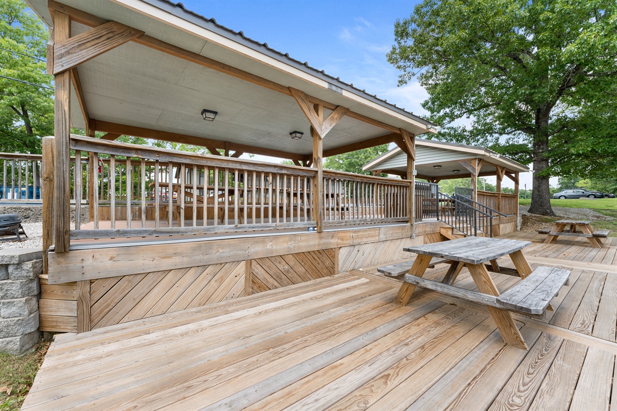 Picnic tables and covered common space make casual outdoor meals easy.
