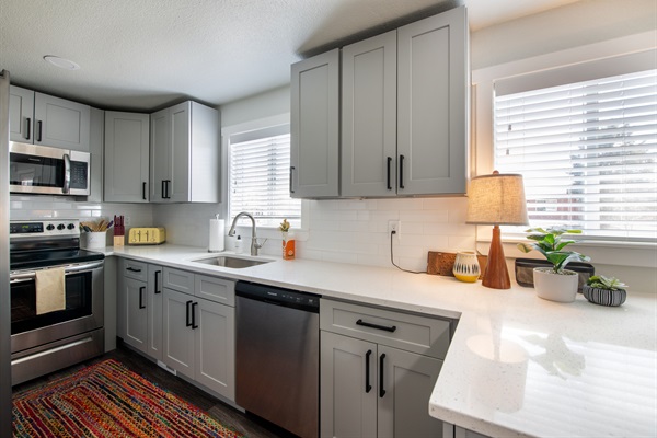 Full appointed and stocked kitchen with utensils and cooking tools