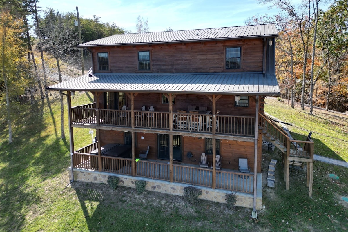 Enjoy a drink in a rocker or a meal or game of cards on the large table on the top porch. Enjoy the hot tub or relaxing on the rockers on the bottom porch. 