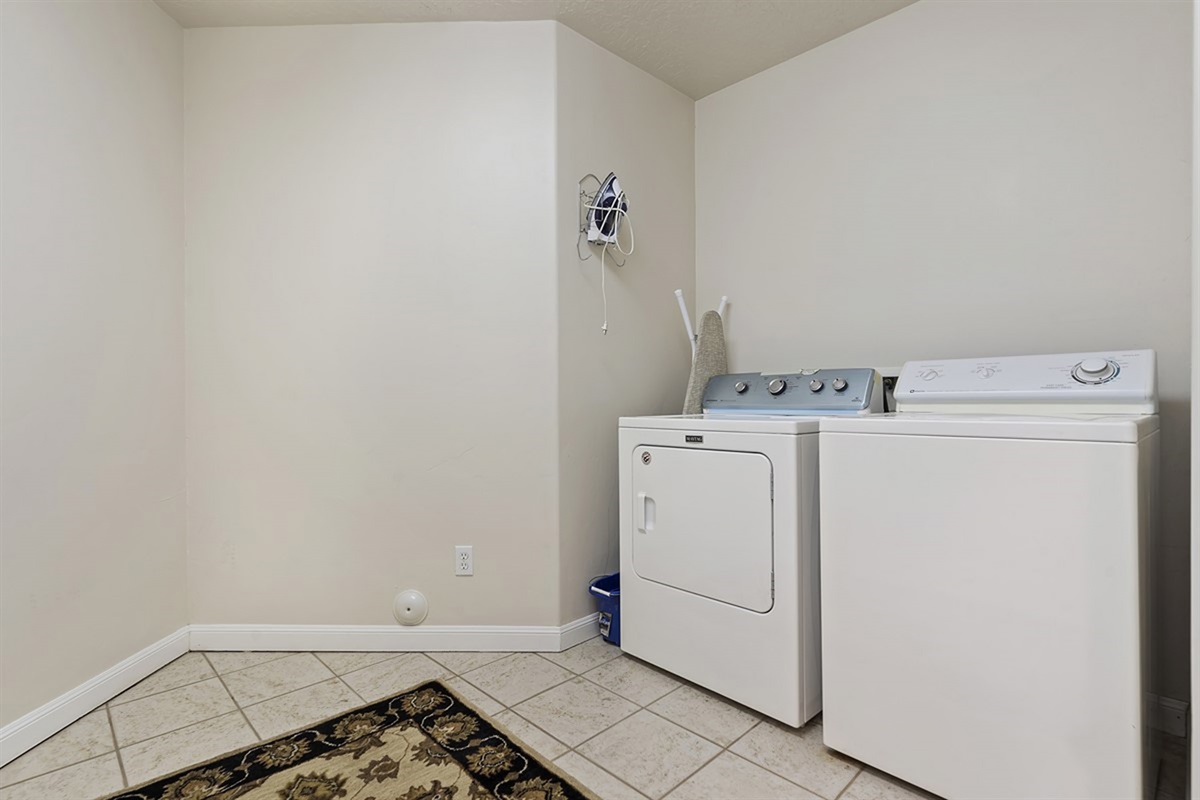Convenient in-unit laundry room with washer and dryer, making longer stays easy and stress-free.