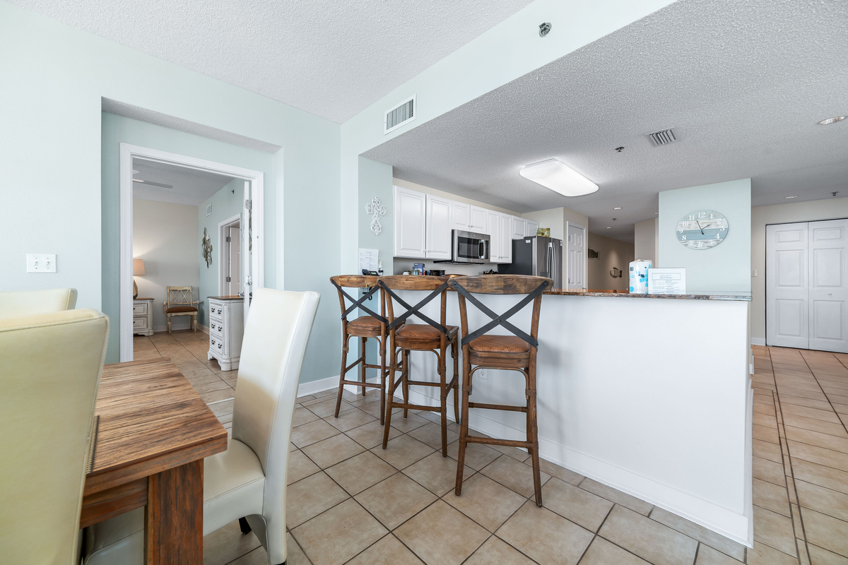 Experience the convenience of this open-concept kitchen, complete with a breakfast bar, modern appliances, and a welcoming atmosphere.